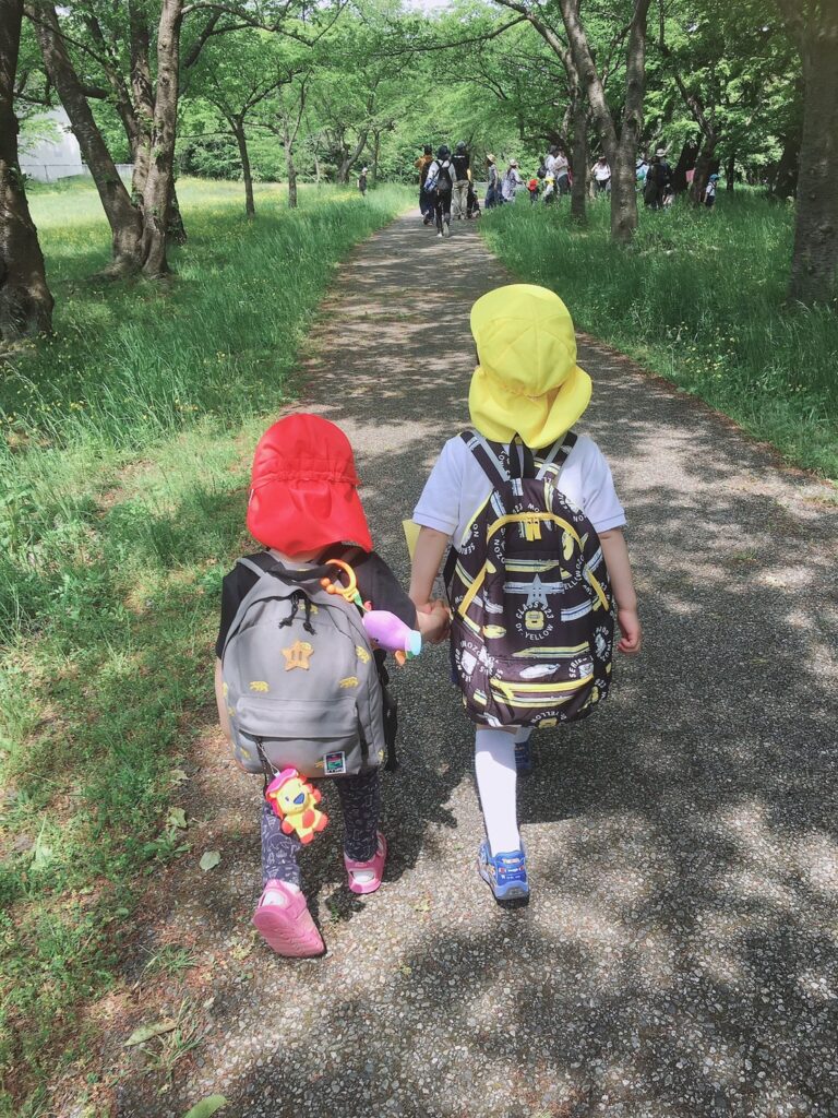 backpacks holding hands